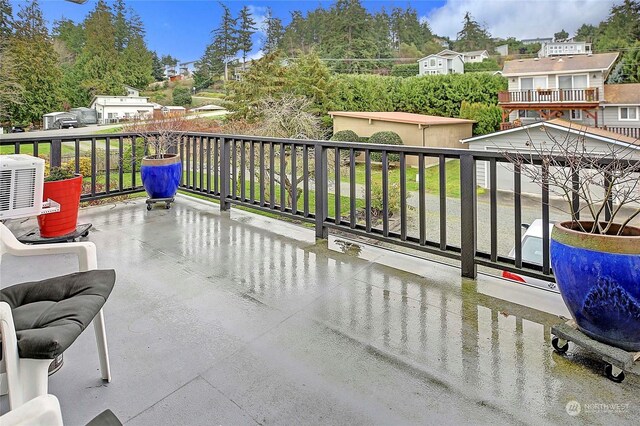 view of patio featuring a balcony