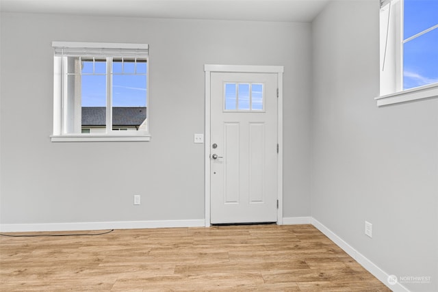 entryway with light hardwood / wood-style flooring