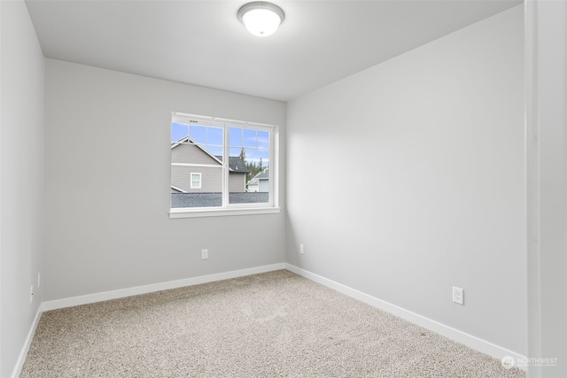 unfurnished room featuring carpet flooring