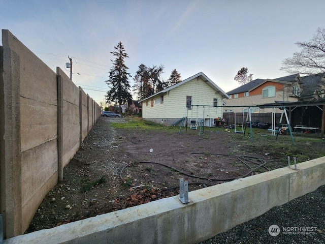 view of side of property featuring a playground