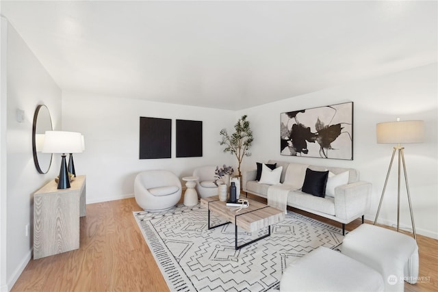 living room with light hardwood / wood-style flooring