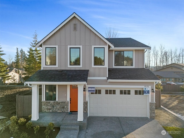 view of front of house featuring a garage and covered porch