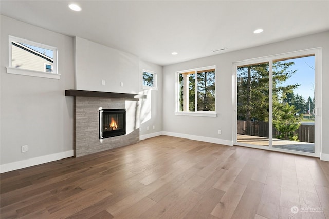 unfurnished living room featuring wood-type flooring