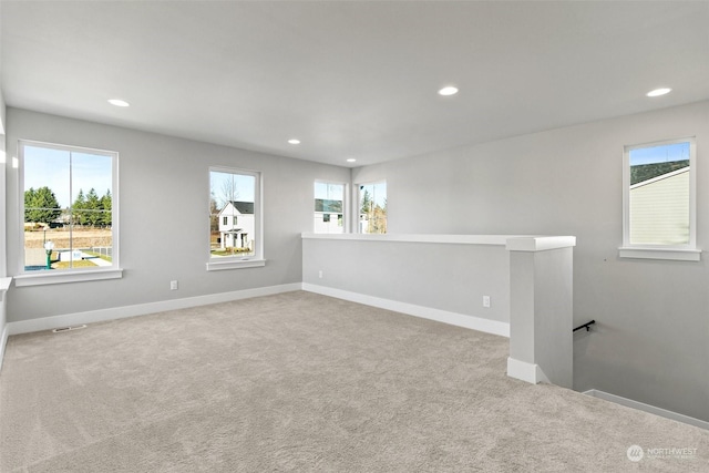 spare room with light colored carpet