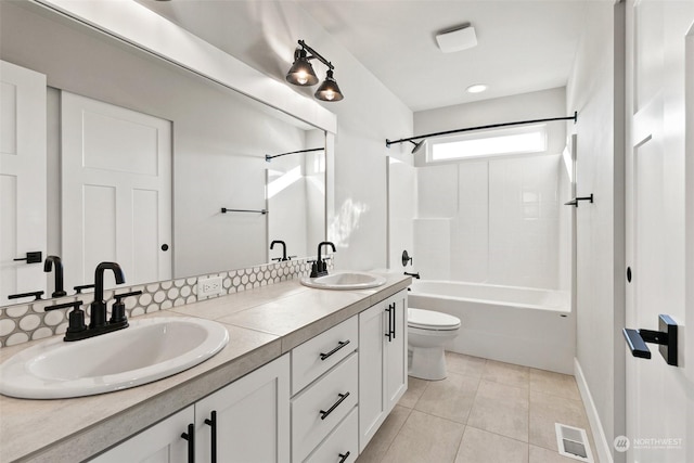 full bathroom featuring toilet, vanity, bathtub / shower combination, and tile patterned flooring