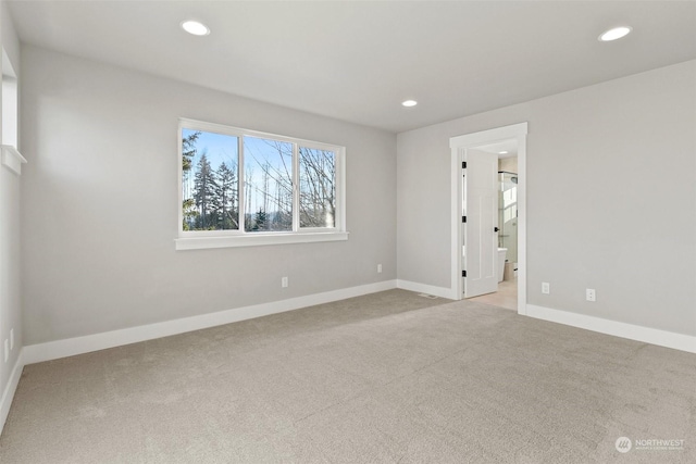 empty room featuring light colored carpet