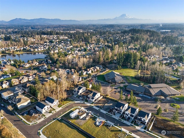 bird's eye view featuring a water and mountain view