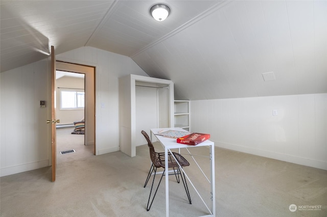 bonus room featuring light colored carpet and vaulted ceiling