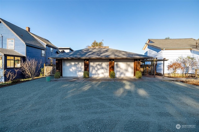 front of property with an outbuilding and a garage