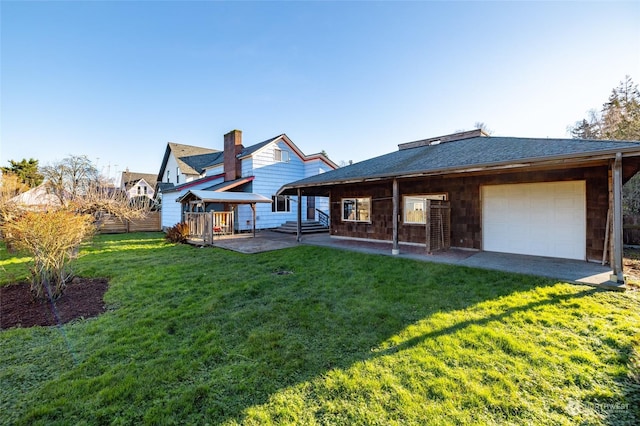 rear view of house with a lawn