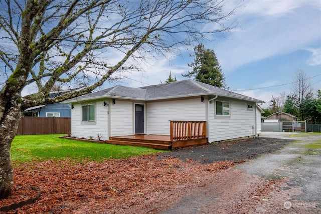 exterior space with a lawn and a deck