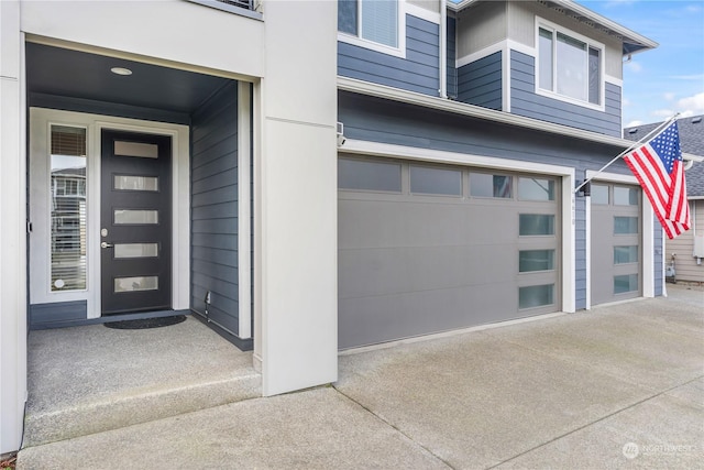 view of exterior entry with a garage