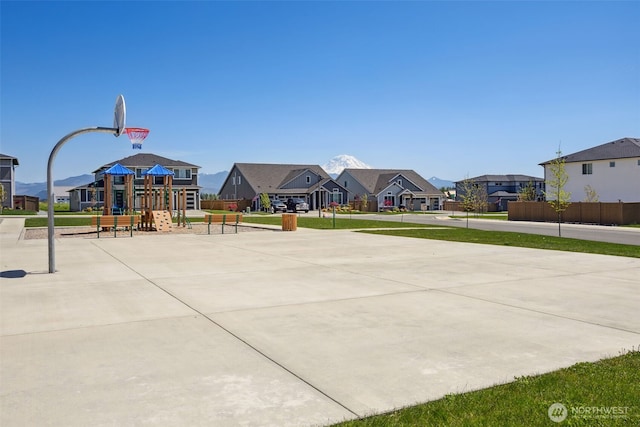 view of sport court with a playground