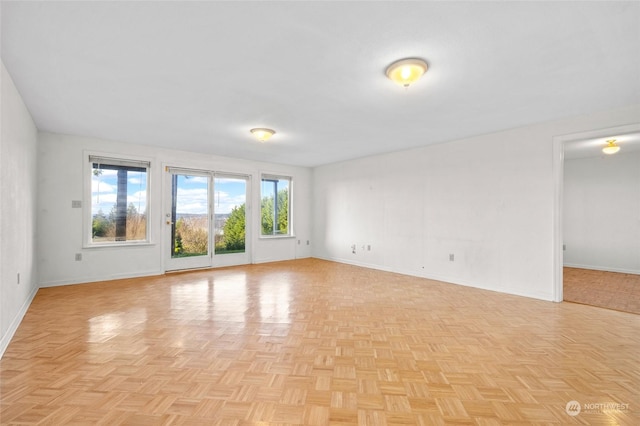 spare room with light parquet flooring