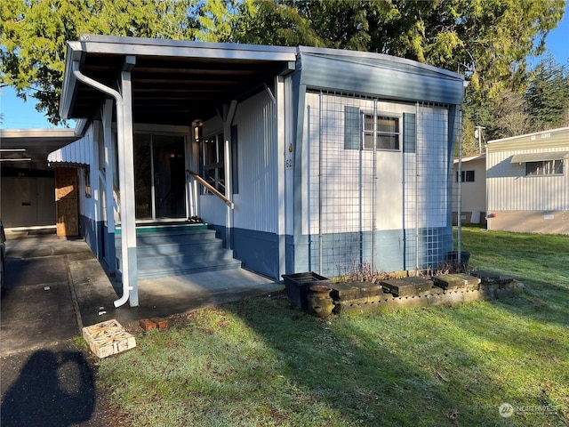 view of outbuilding with a lawn