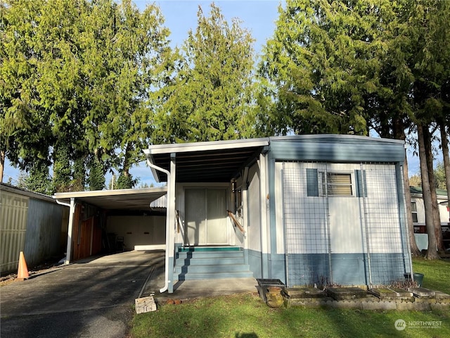 view of front of home with a carport