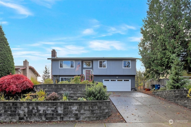 split foyer home featuring a garage