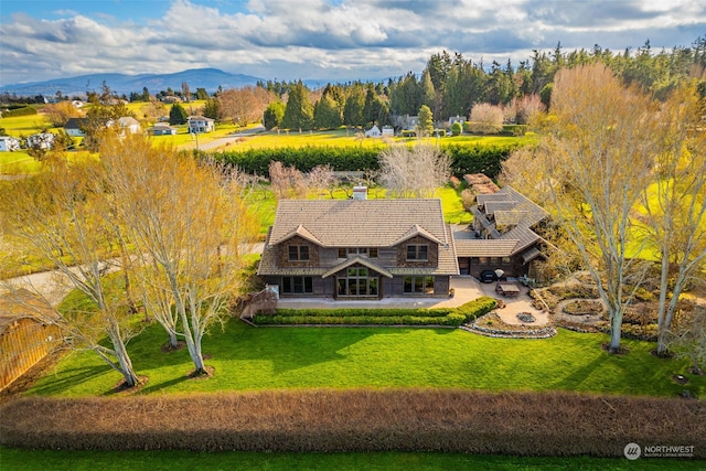 birds eye view of property featuring a mountain view