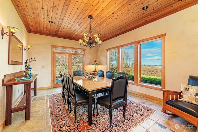 dining room featuring french doors, an inviting chandelier, wooden ceiling, and crown molding