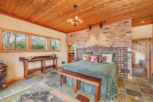 bedroom with an inviting chandelier, track lighting, and wooden ceiling