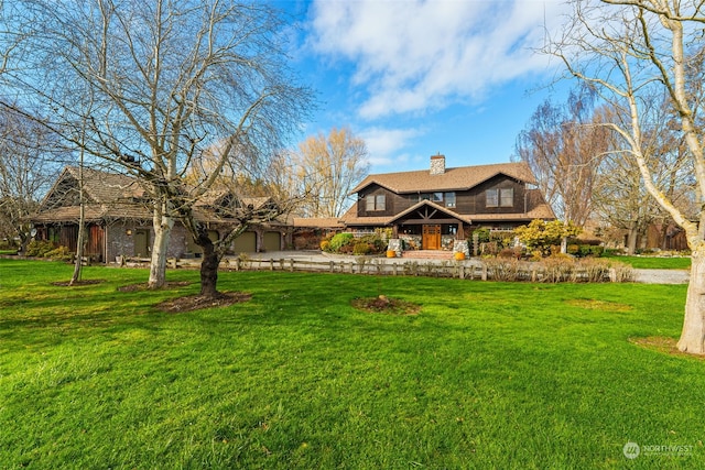 view of front of home with a garage and a front yard