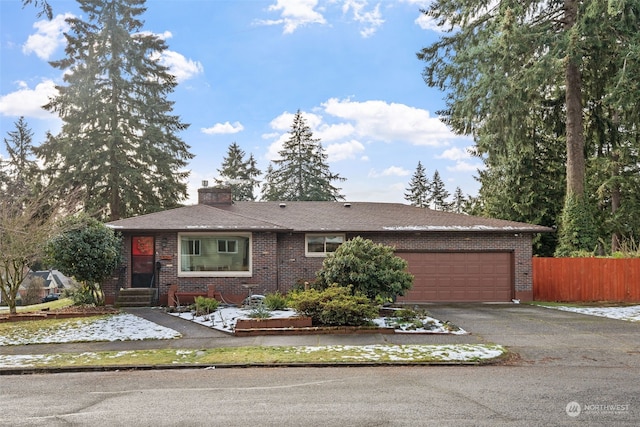 ranch-style house featuring a garage