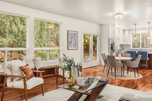 interior space with french doors and light wood-type flooring