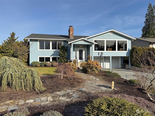 bi-level home featuring a garage