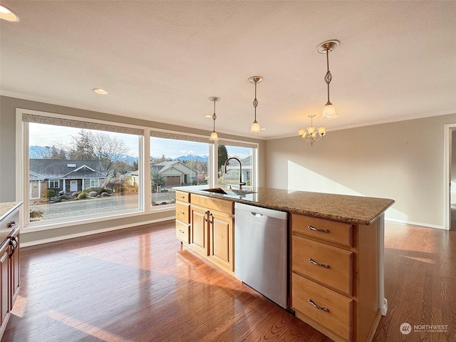 kitchen featuring sink, crown molding, stainless steel dishwasher, pendant lighting, and light stone countertops