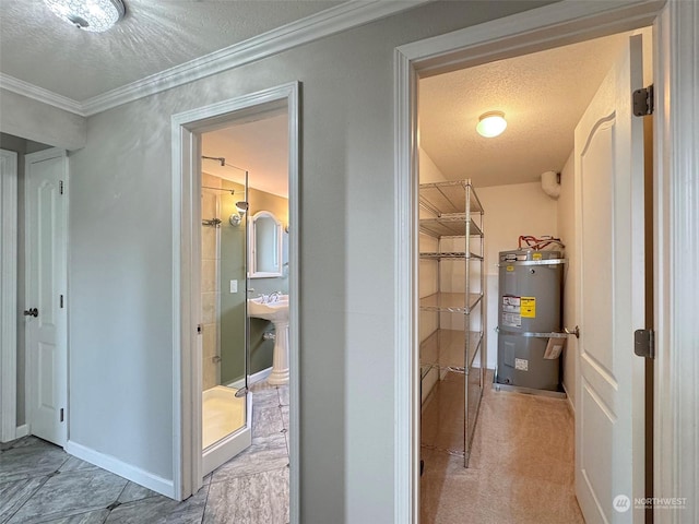 interior space featuring water heater, ornamental molding, and a textured ceiling