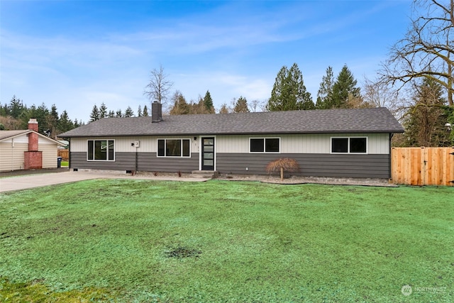 ranch-style home with a front lawn