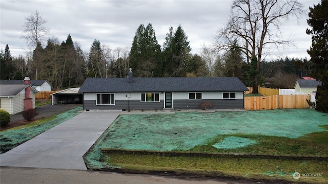 single story home with a front lawn and a carport