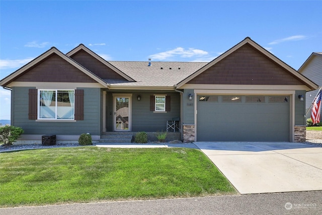 view of front of home featuring a front lawn and a garage