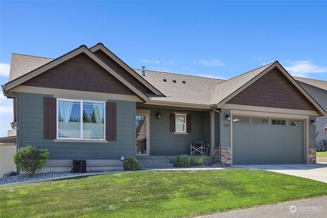 view of front facade with a front lawn and a garage