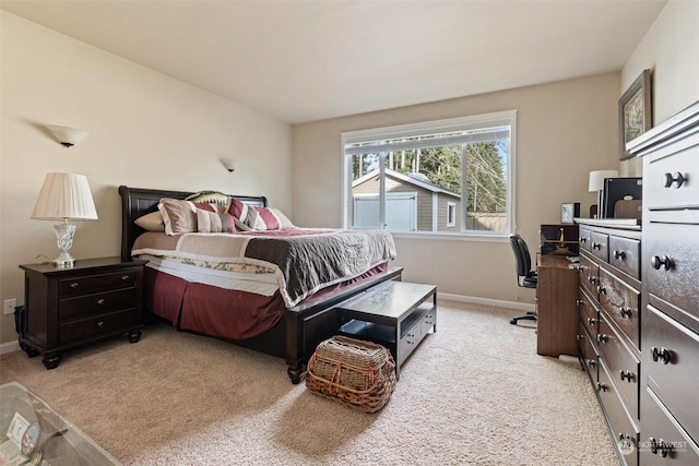 bedroom featuring light carpet