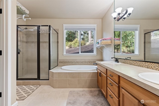 bathroom with separate shower and tub, tile patterned flooring, and a healthy amount of sunlight