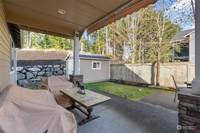 view of patio / terrace with a storage shed