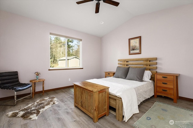 bedroom with wood-type flooring, vaulted ceiling, and ceiling fan