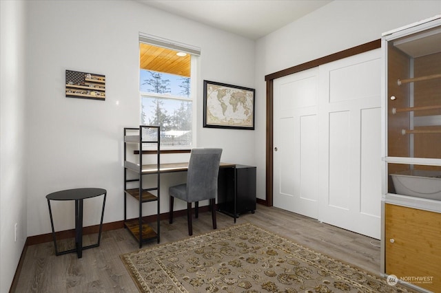 office space with hardwood / wood-style floors