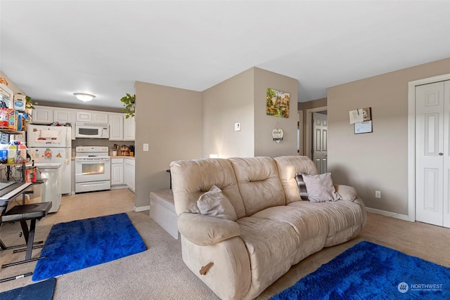 living room featuring light carpet