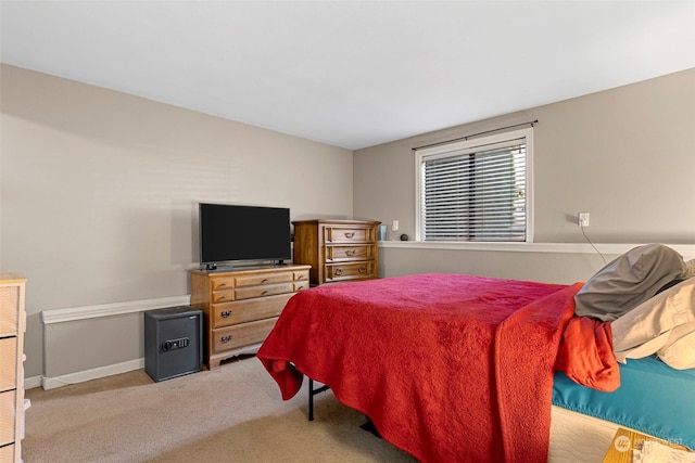 bedroom featuring light carpet