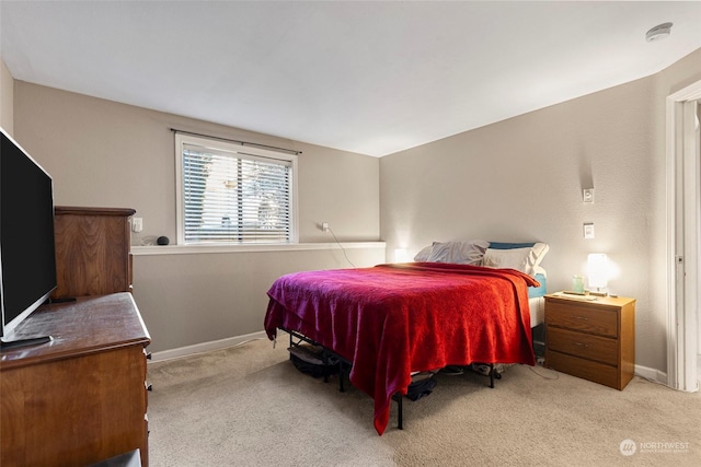 bedroom with light carpet