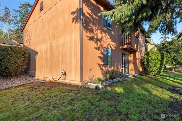 view of home's exterior featuring a yard