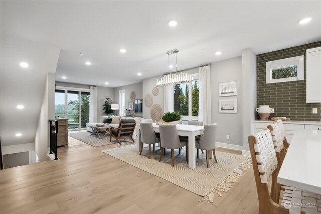 12327 137th Pl NE Unit 3102, Redmond, WA 98052 - dining room with light hardwood / wood-style flooring and plenty of natural light