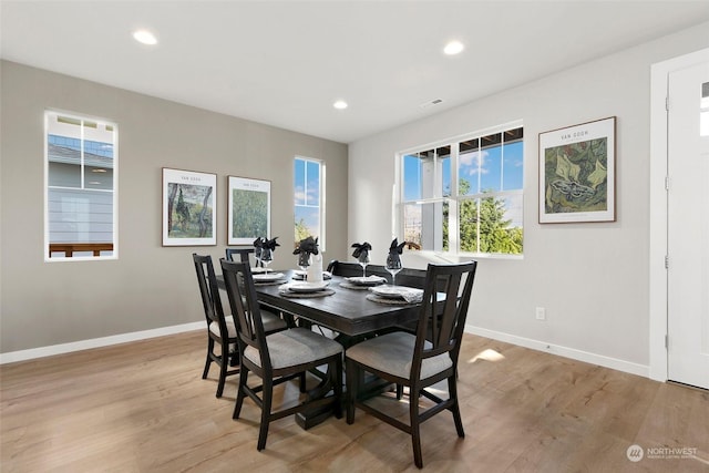 dining space with light wood-type flooring