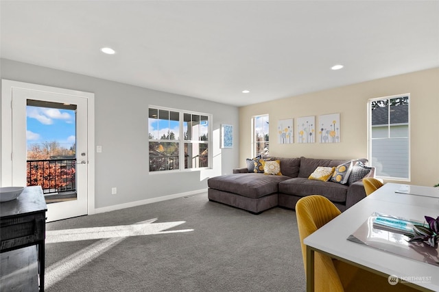 living room featuring carpet floors and a healthy amount of sunlight