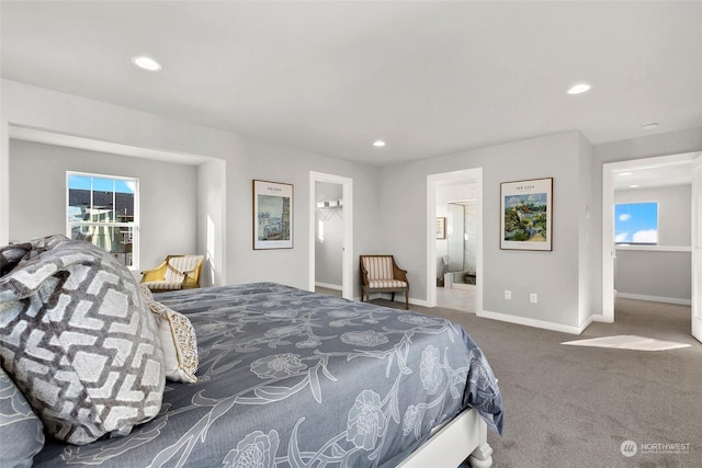 carpeted bedroom featuring ensuite bathroom