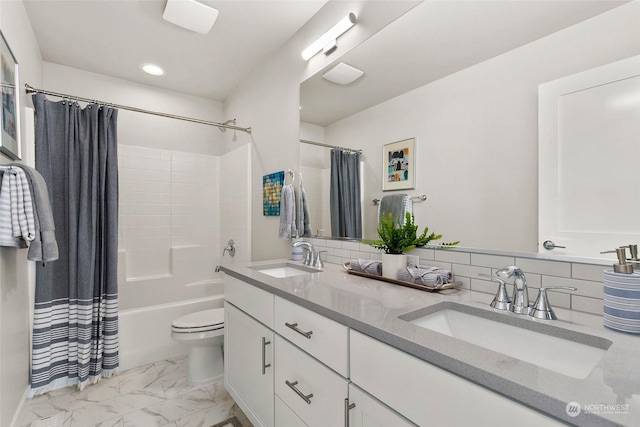 full bathroom with shower / bath combo, vanity, and toilet