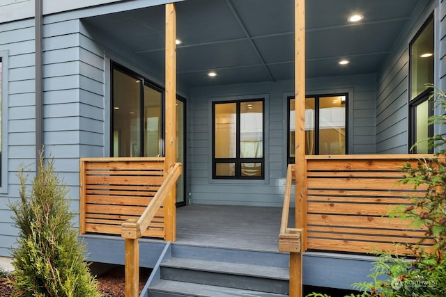 doorway to property featuring covered porch