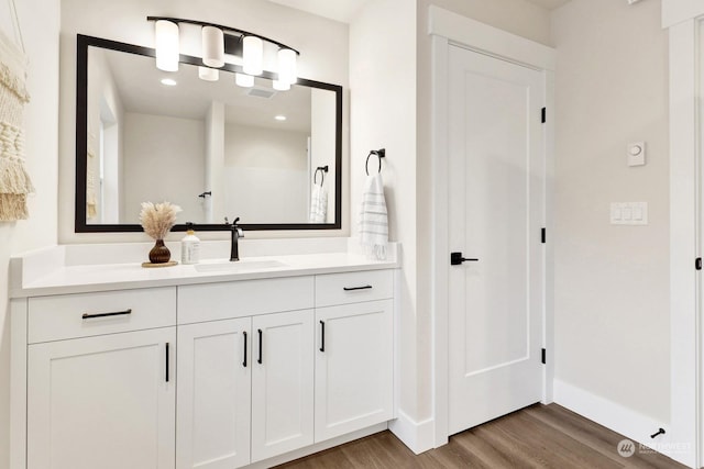 bathroom featuring hardwood / wood-style floors and vanity